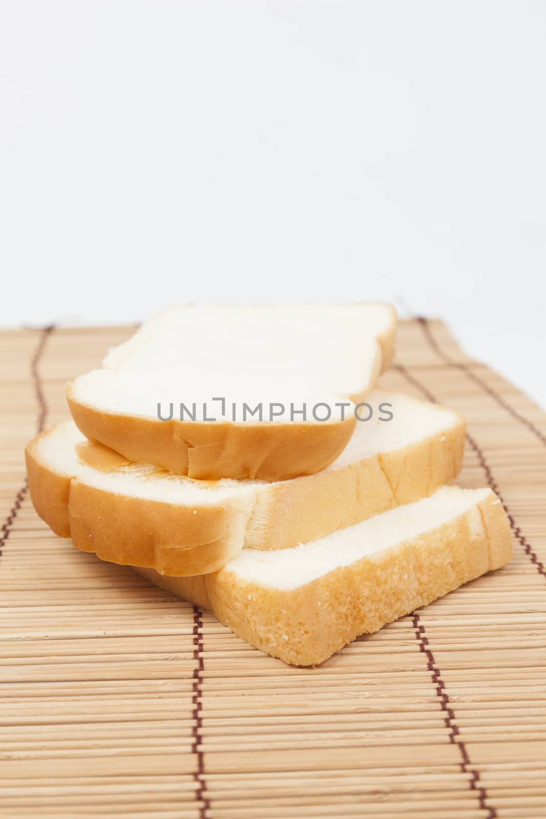 Sliced ������bread on the wooden plate.pack-shot bread in studio.