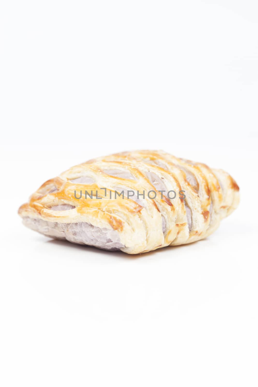 bread on white isolated background.Bread baked with a sweet fruit filling inside.