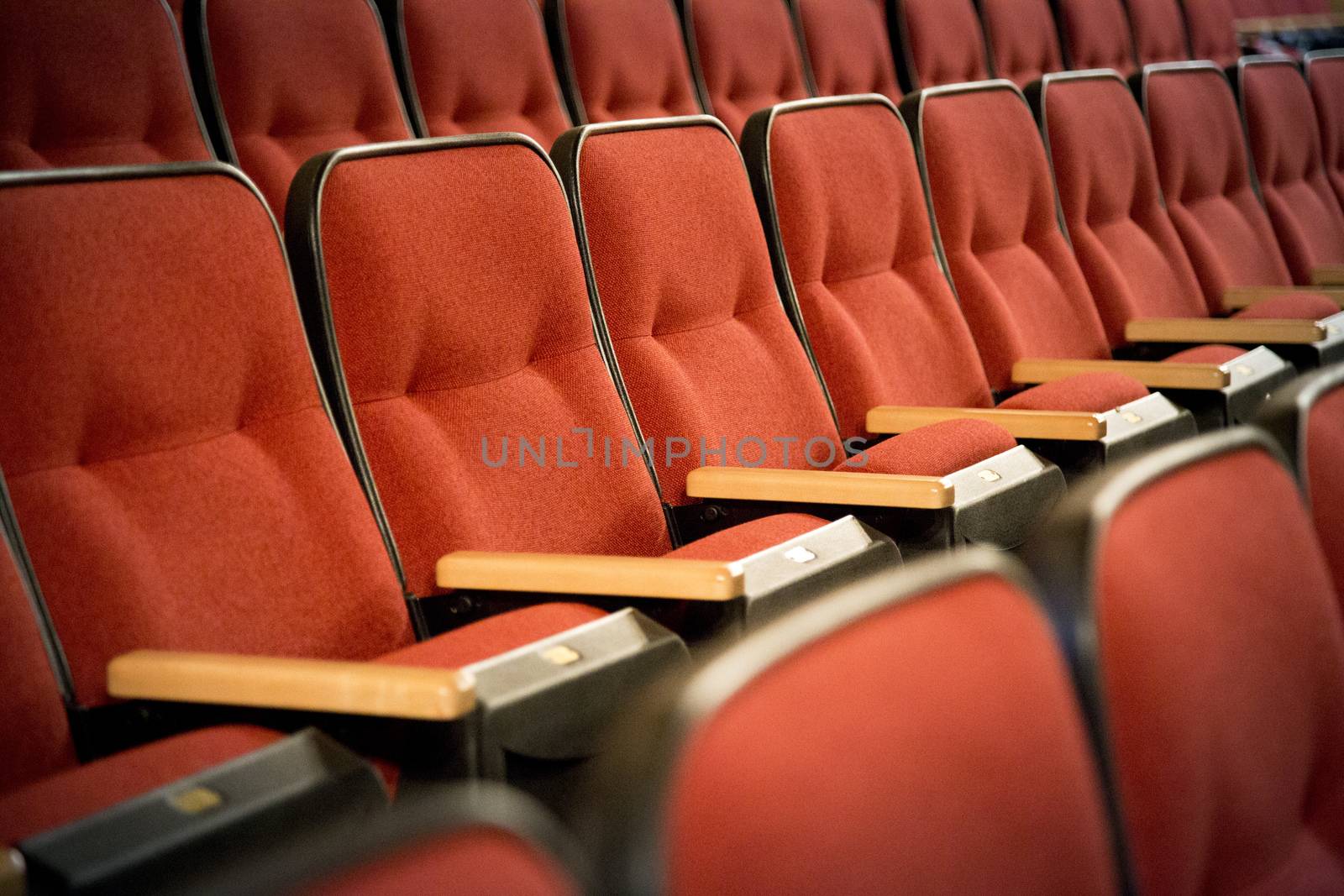 Row of red theatre seats by HD_premium_shots
