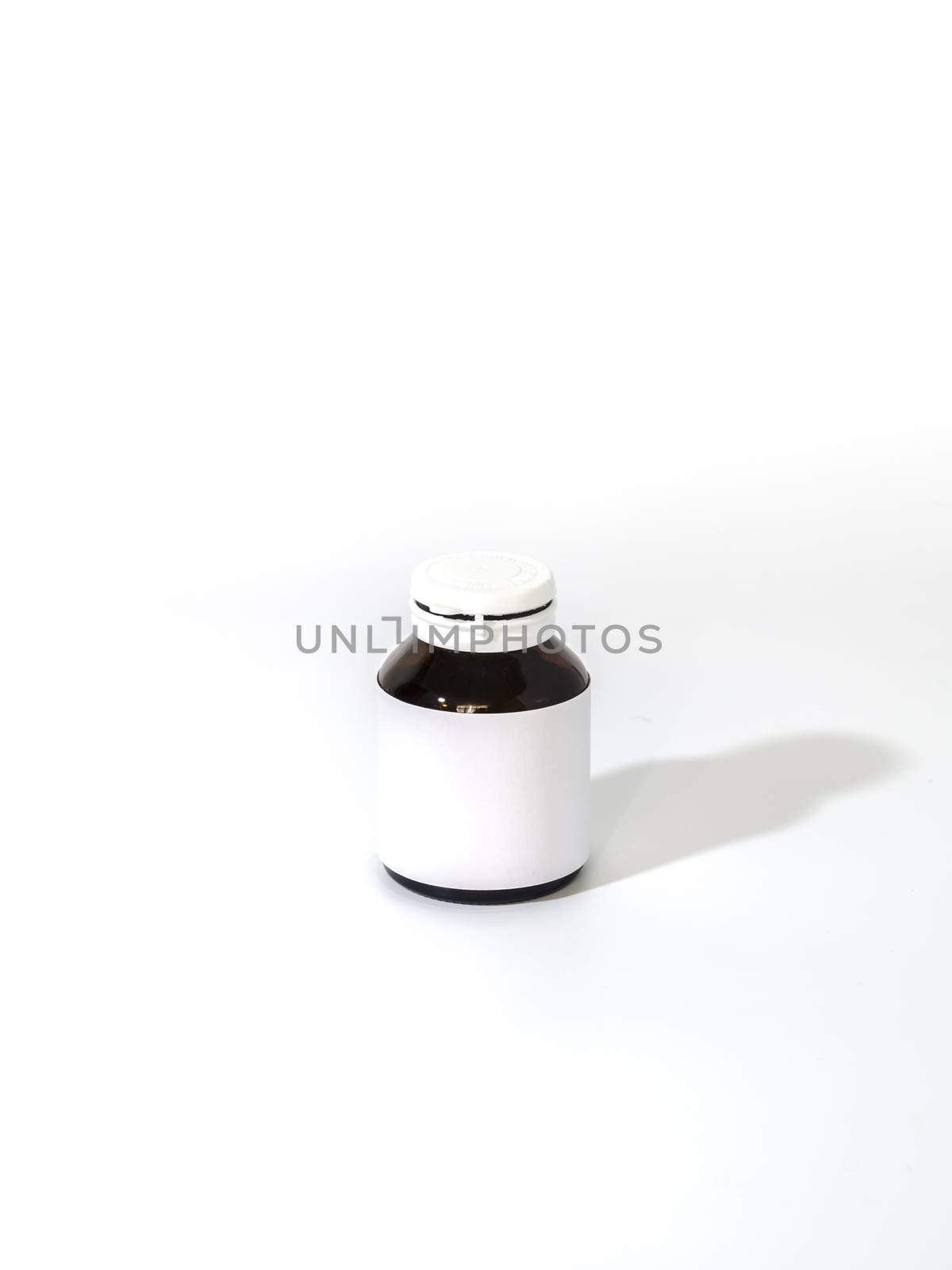 empty pill bottle on a white background
