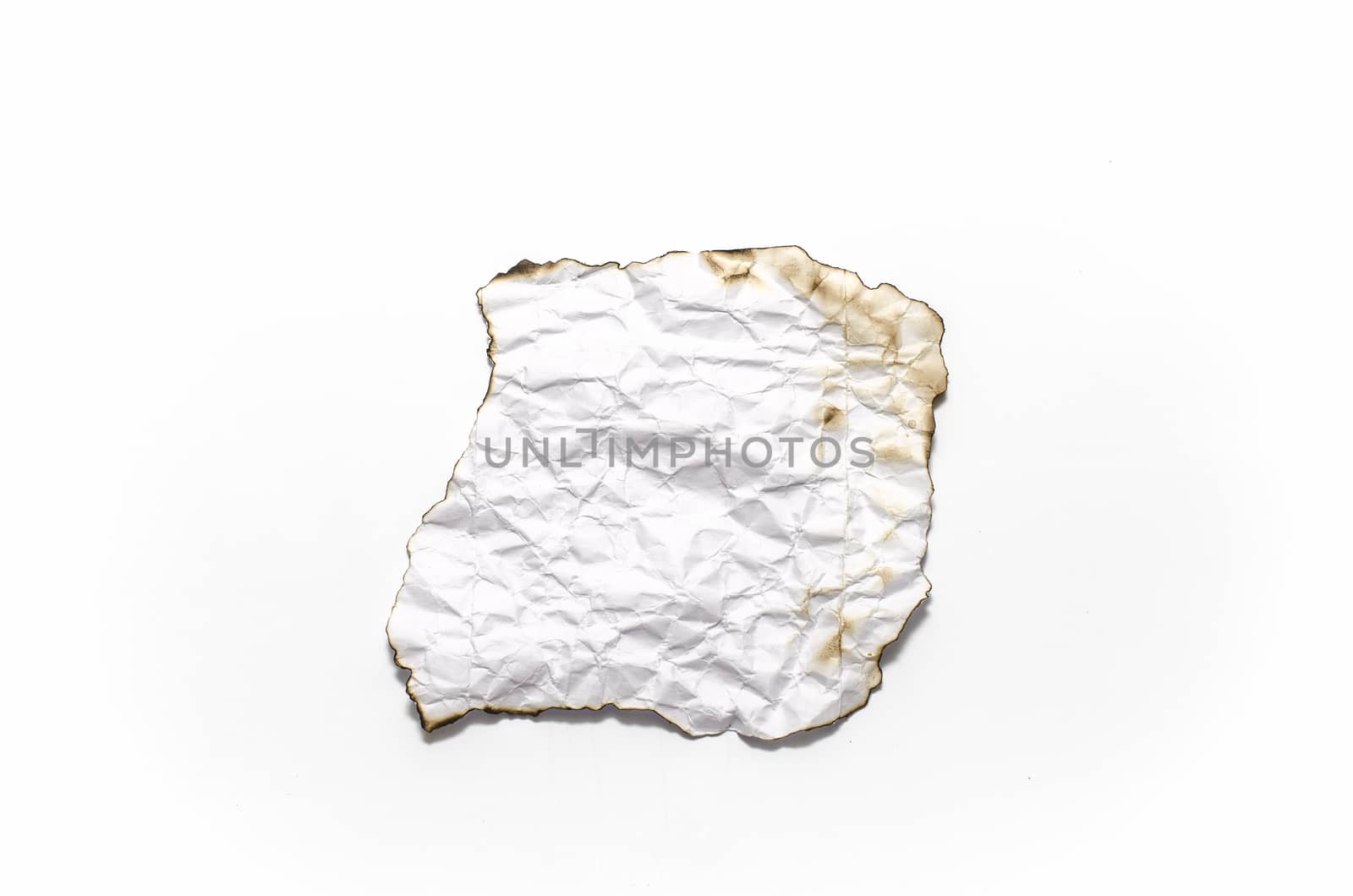 burn of crumpled paper on a white background