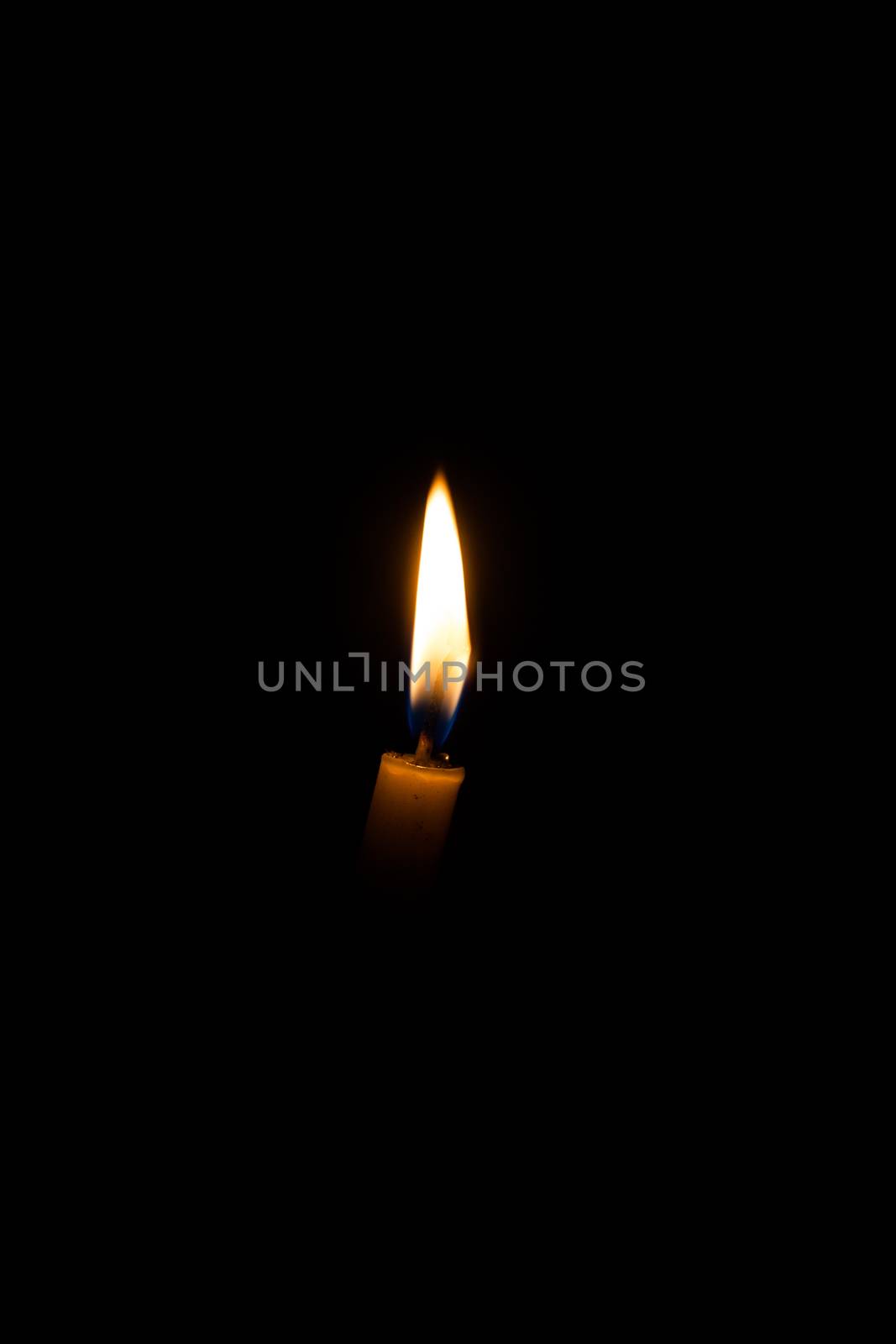 Candle in the dark background