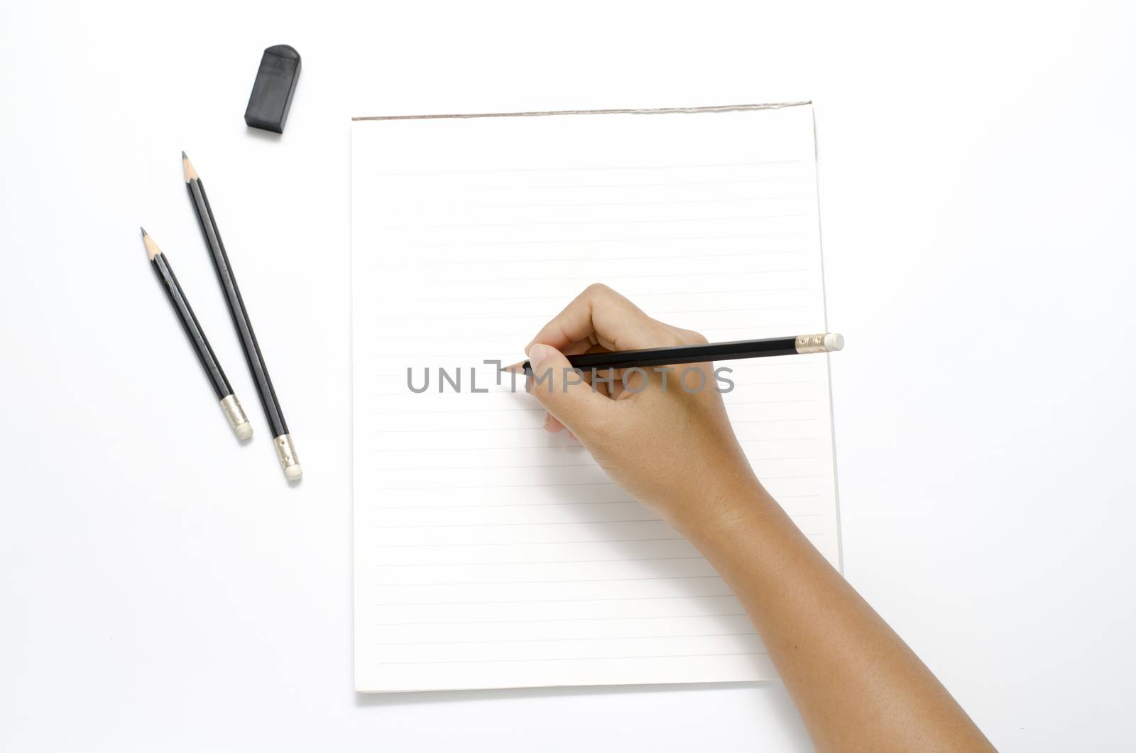 asia woman right hand writing with black pencil on paper over white background