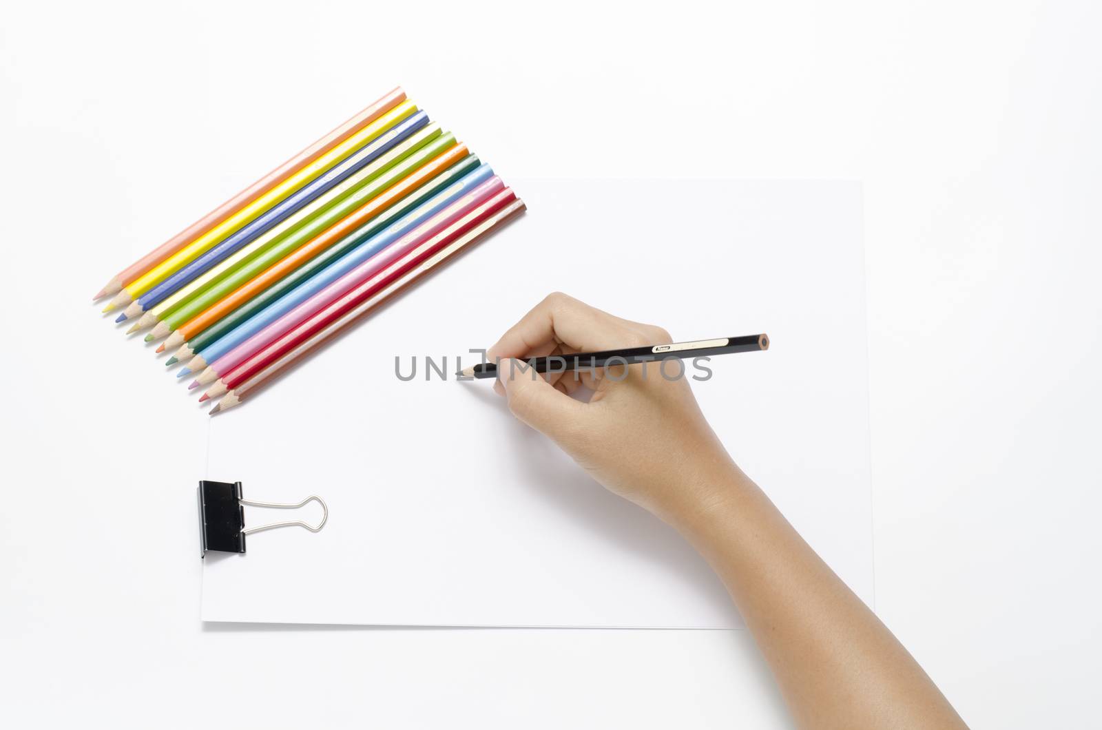 asia woman right hand with black pencil and left hand with colorful pencil on blank white paper over white background