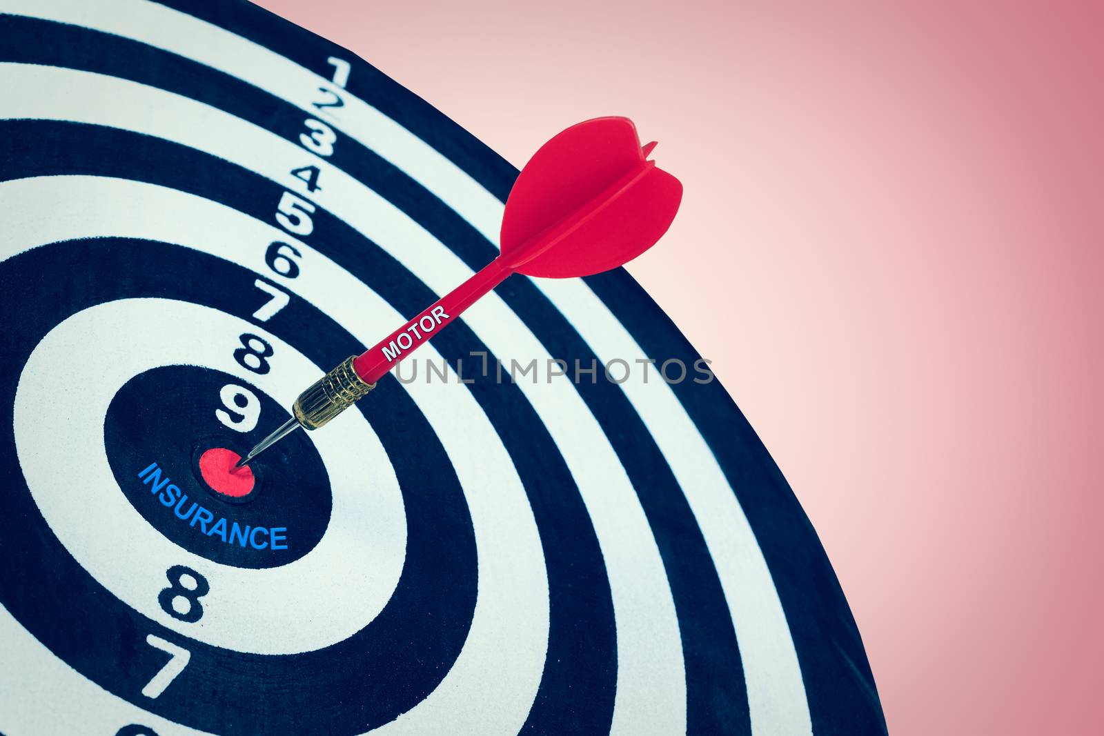 Business motor insurance concept and darts board