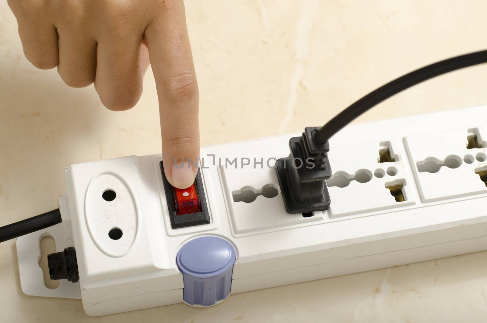 asia woman hand turn on switch multiple  socket plug electric
