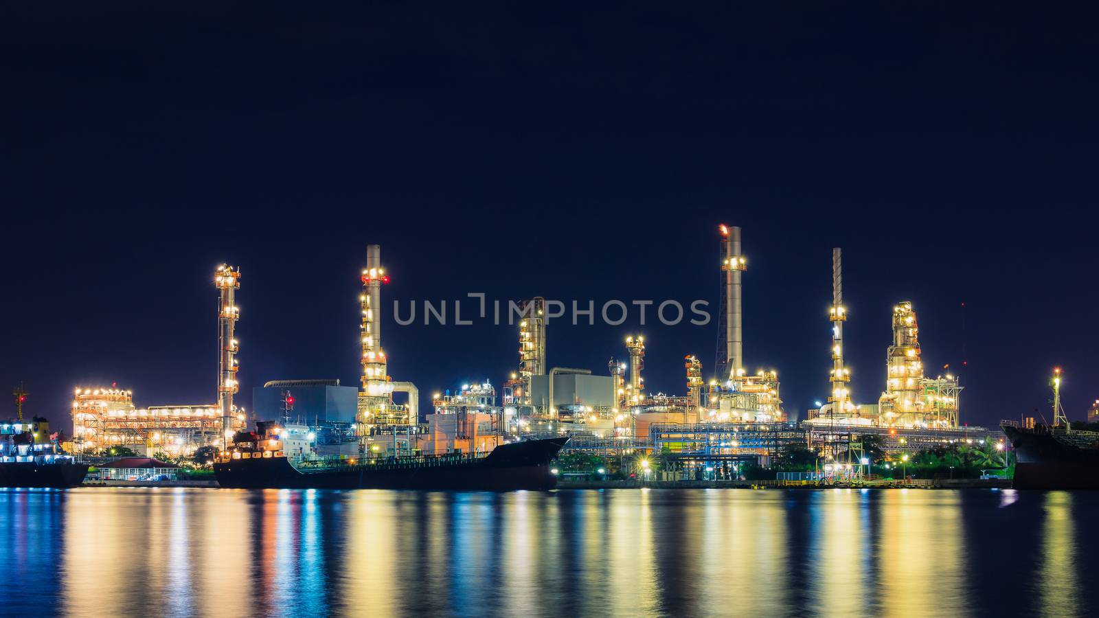 Oil refinery at twilight, business logistic concept