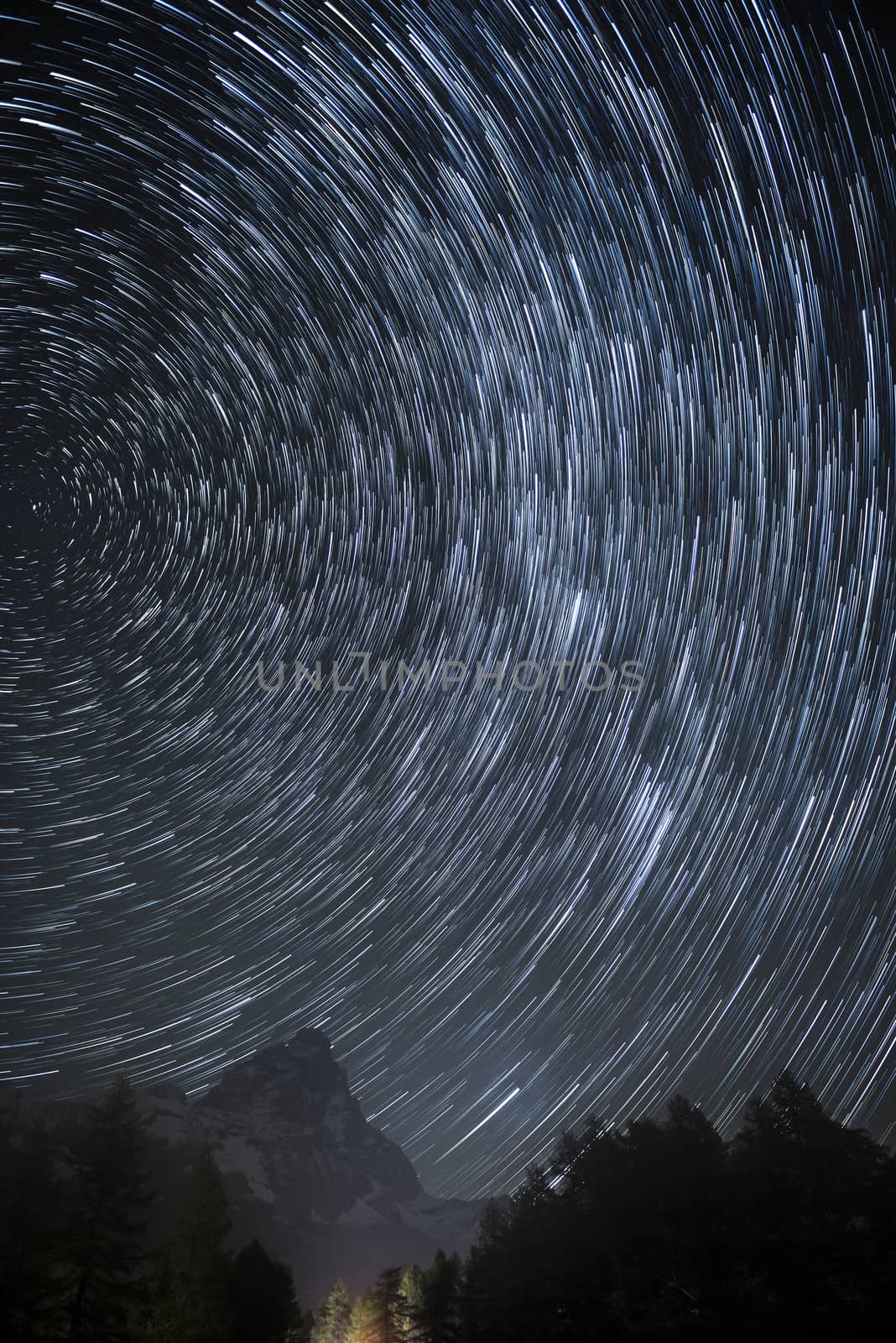 Star trails over the Mount Cervino in an autumn night, Aosta Valley