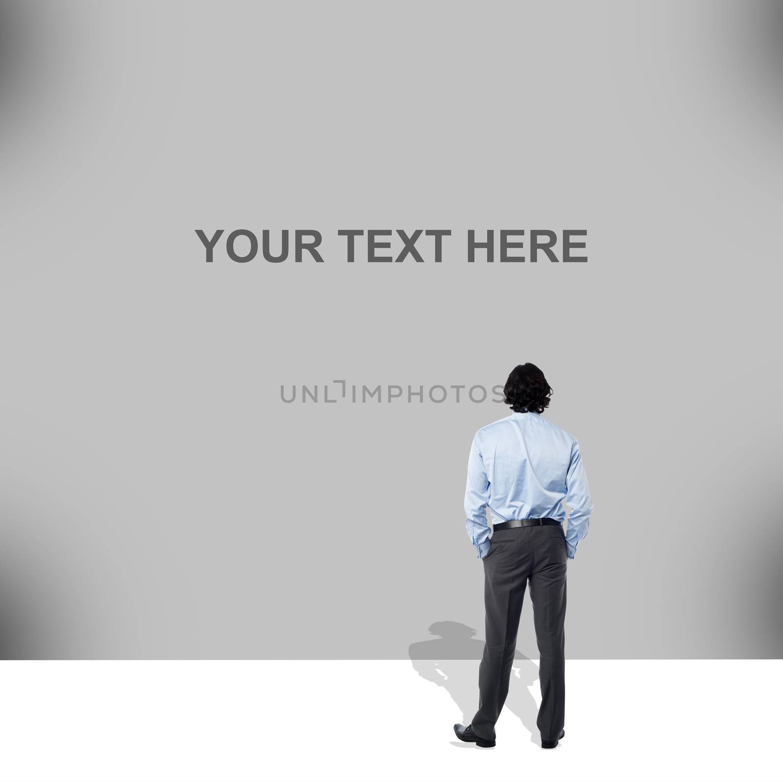 Businessman standing and looking big blank banner