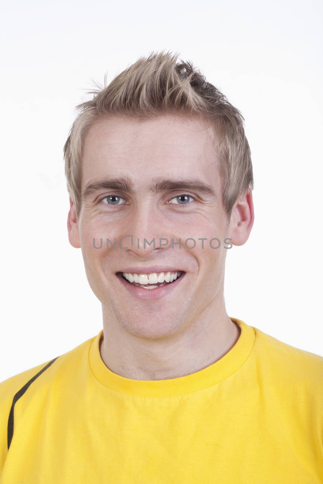 portrait of a young handsome man smiling - isolated on white