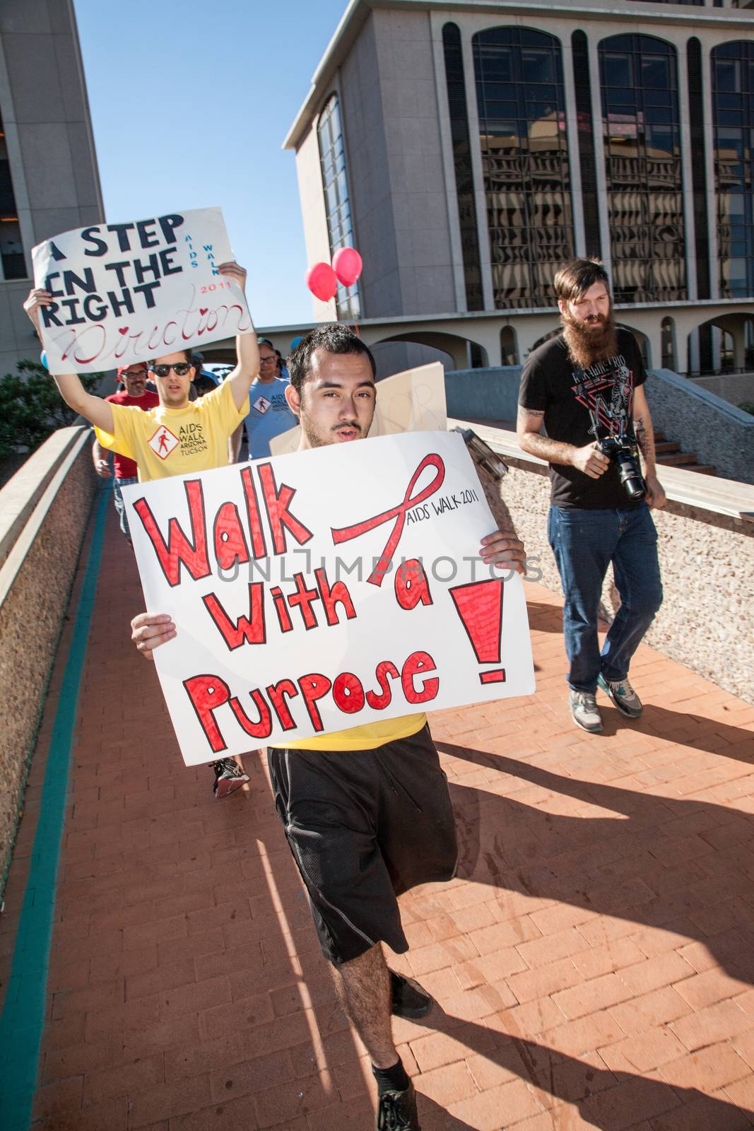 Walkers with Signs at Tucson AIDSwalk by Creatista