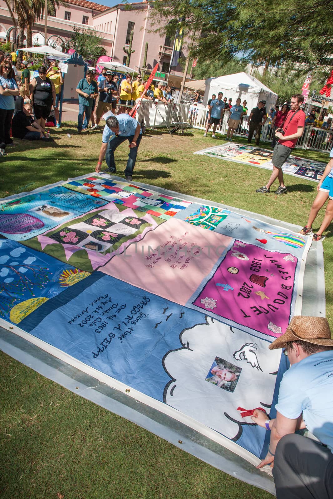 Revealing Section of AIDS Quilt at ceremony by Creatista