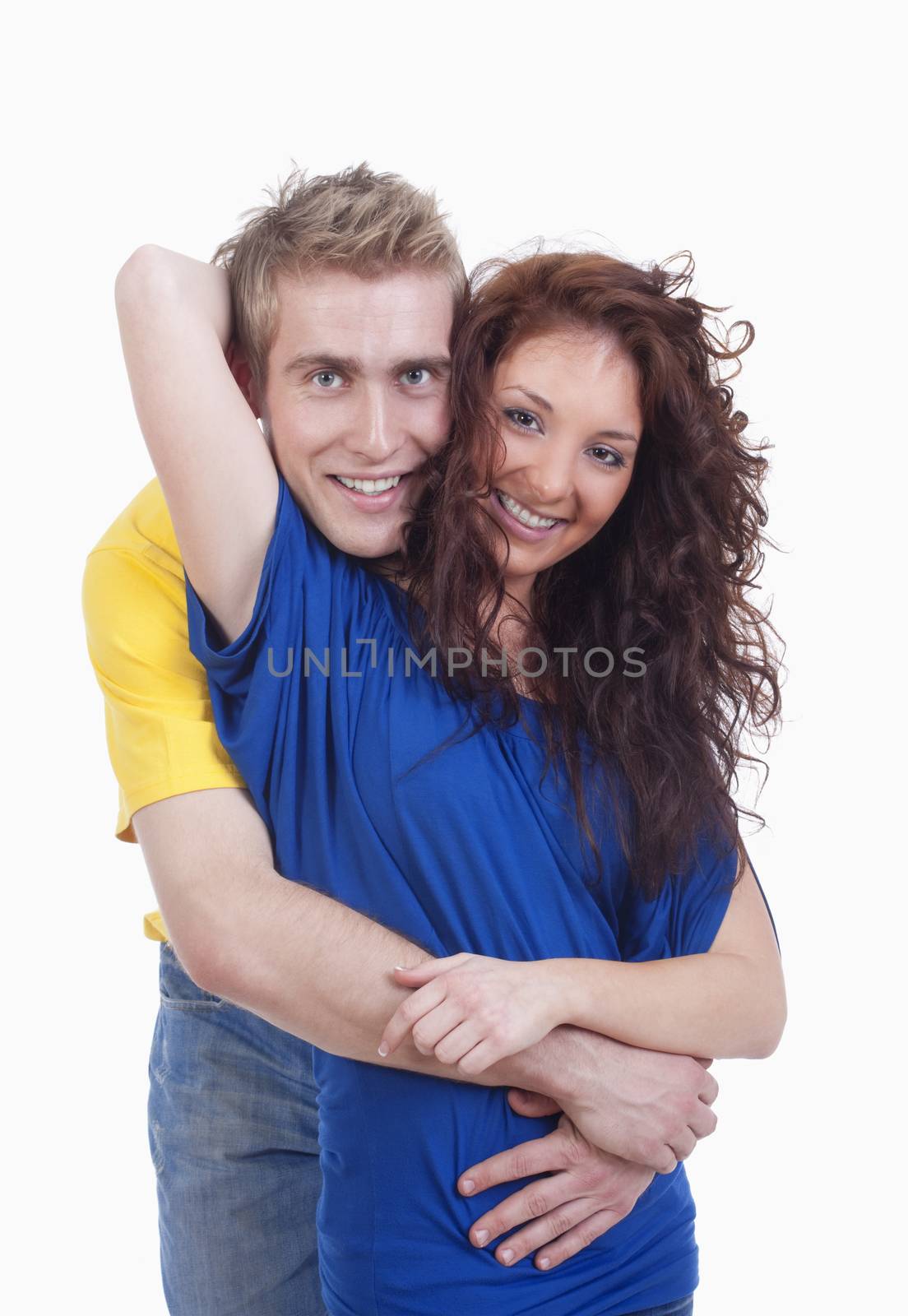 happy young couple - boy embracing girl, smiling - isolated on white