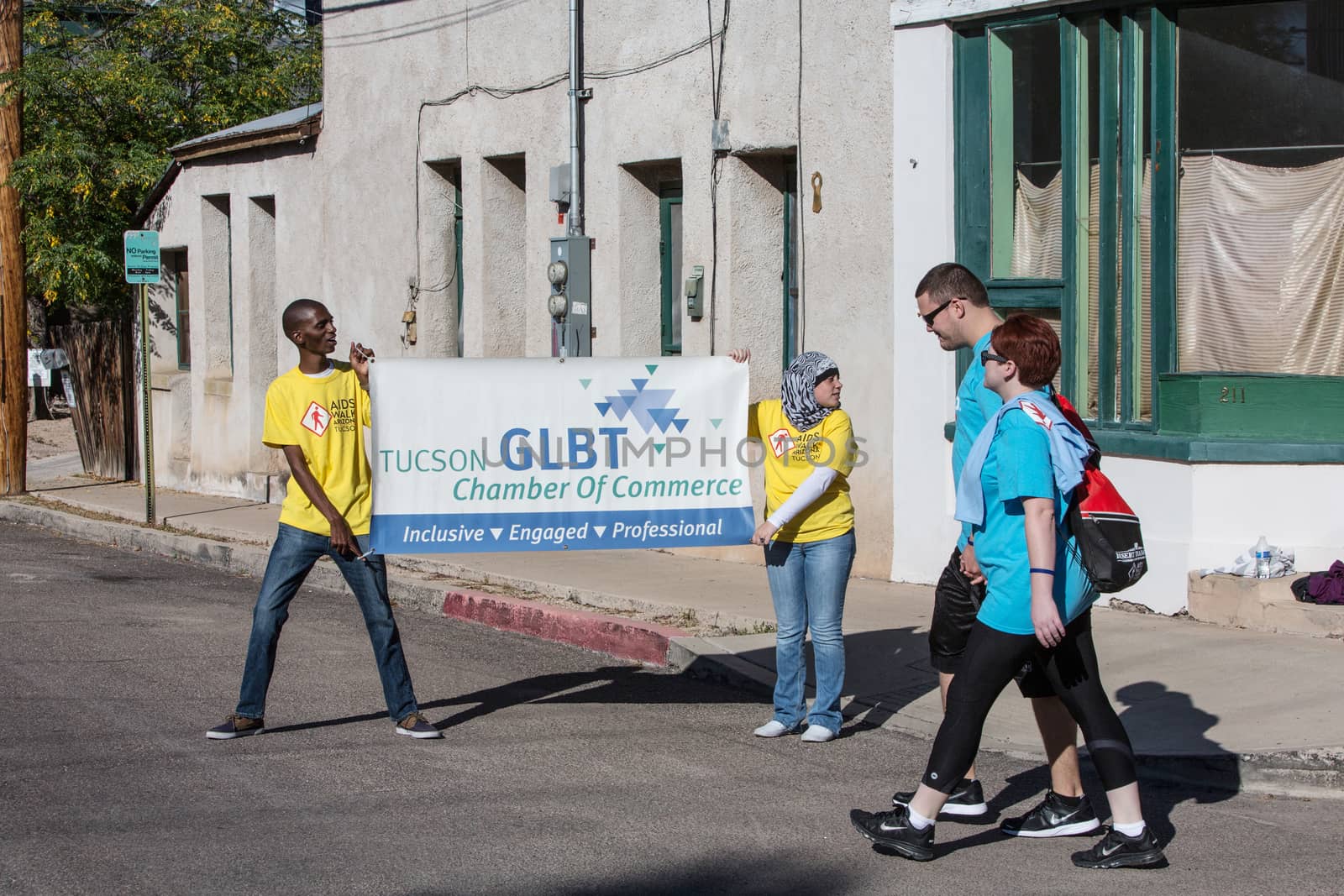 People with GLBT Chamber of Commerce Sign at AIDSwalk by Creatista
