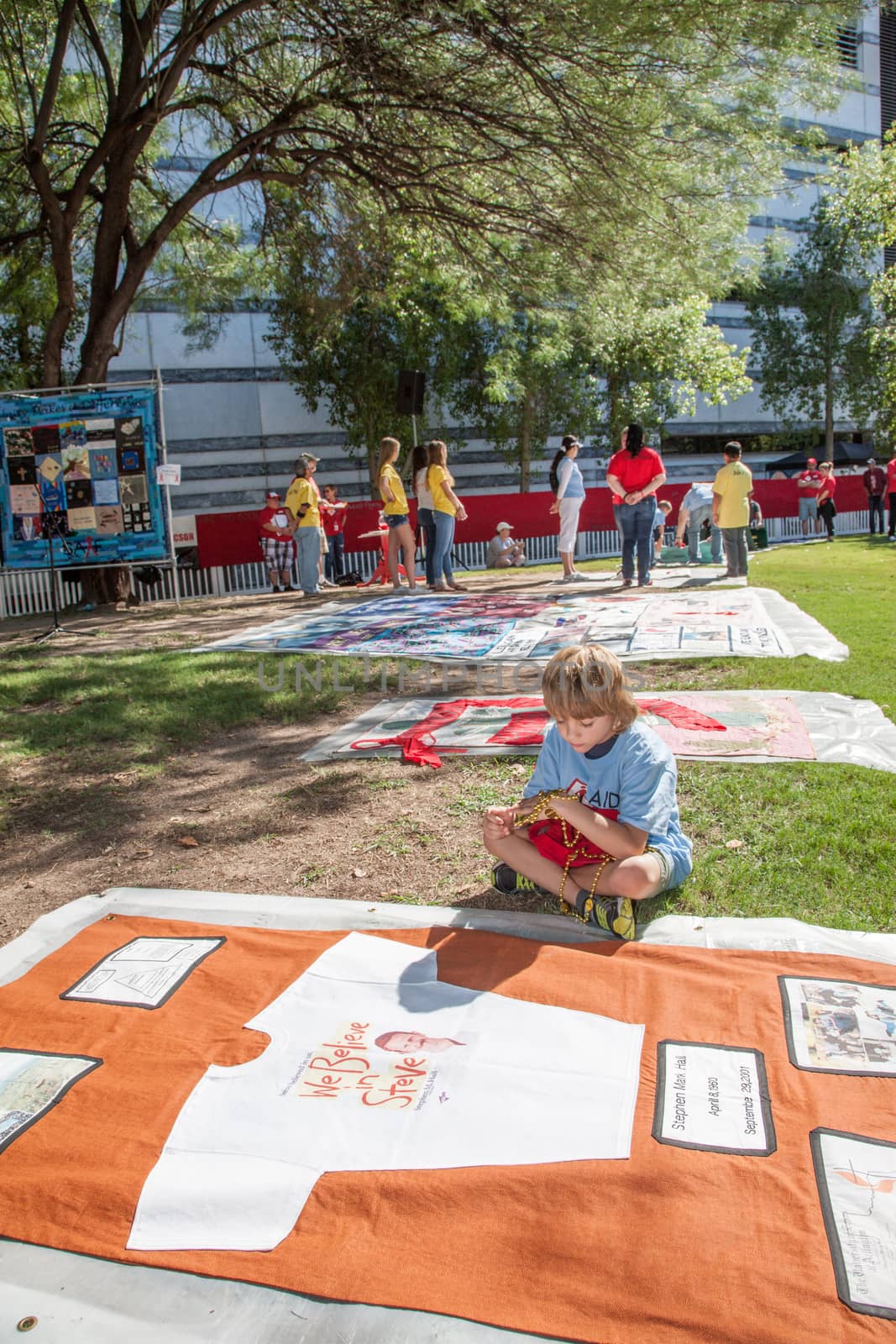 TUCSON, AZ/USA - OCTOBER 12:  Unidentifed boy with section of AIDS Quilt on October 12, 2014 in Tucson, Arizona, USA.