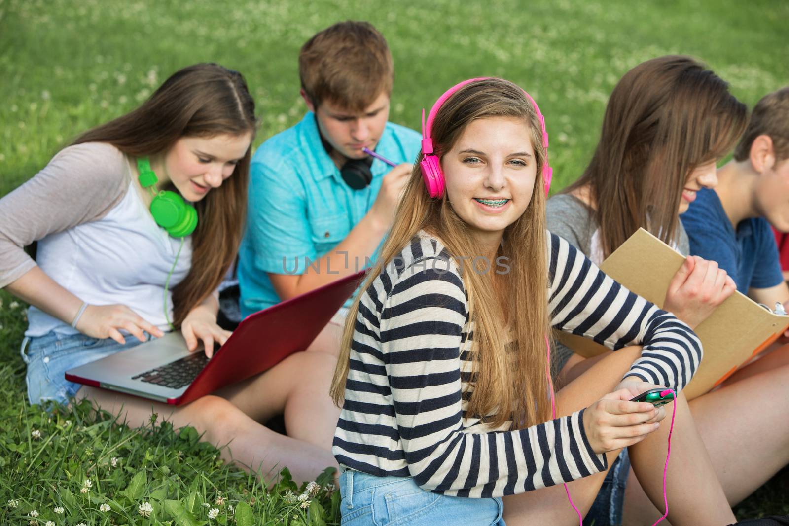 Teen Listening to Music by Creatista