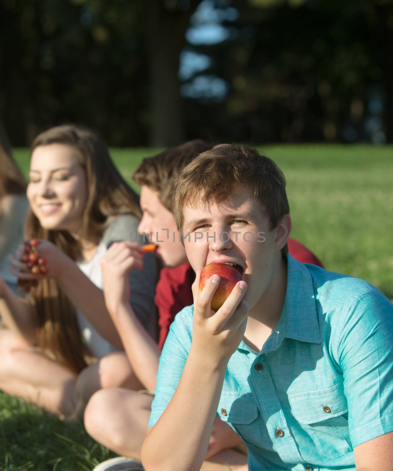 Hungry Teen Eating Apple by Creatista