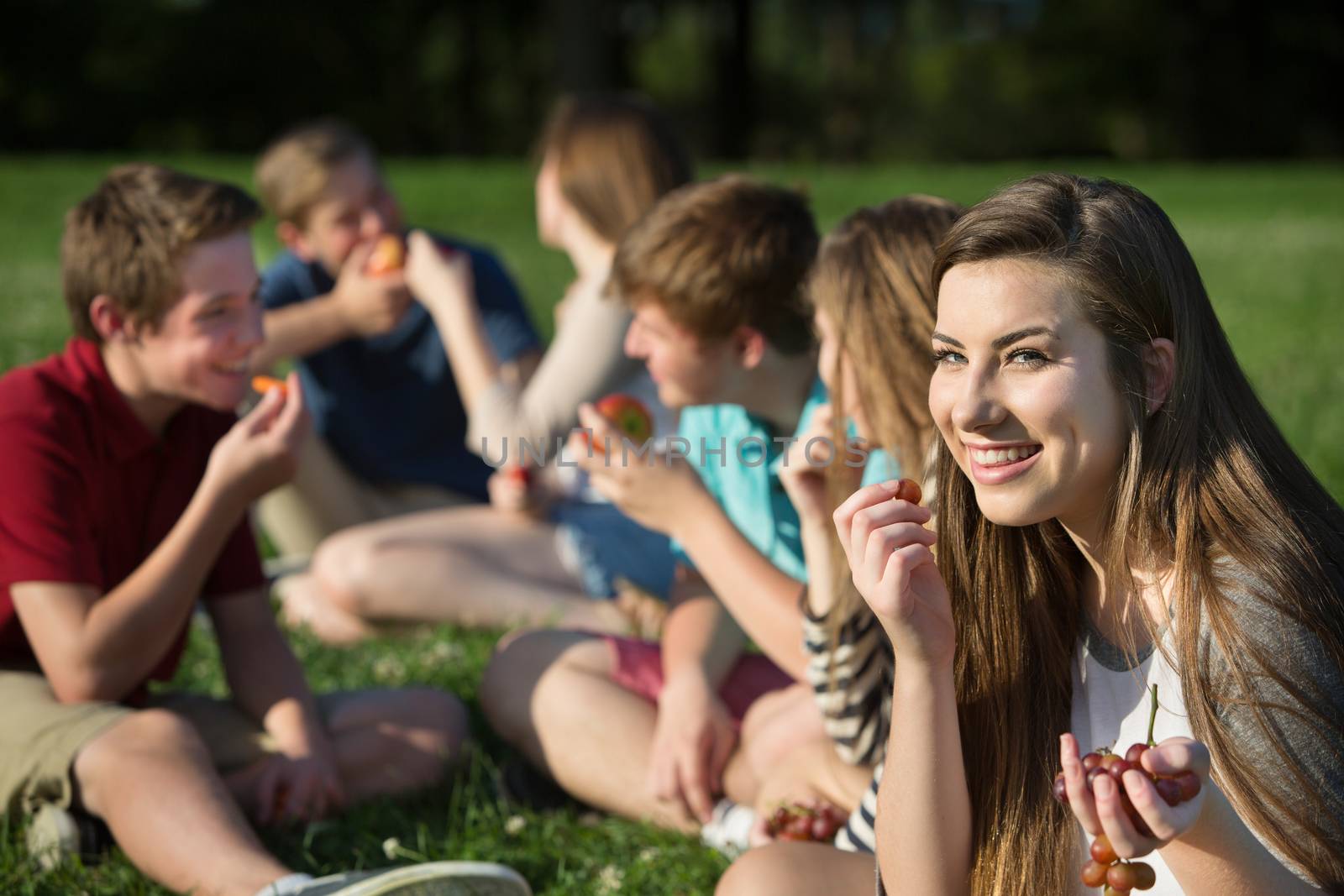 Teen Girl Eating Grapes by Creatista