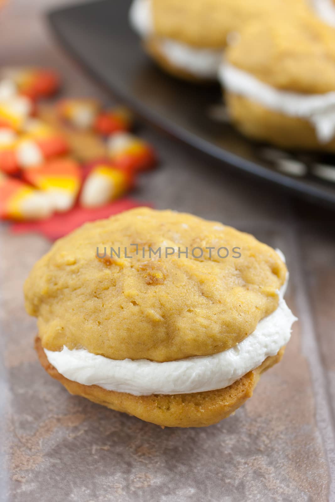 Pumpkin flavored whoopie pie cakes with whipped vanilla cream filling.