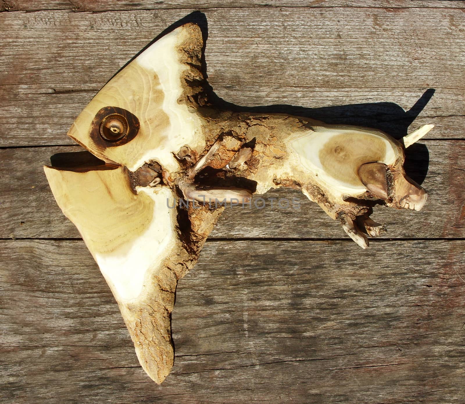 Wooden fish on wooden background