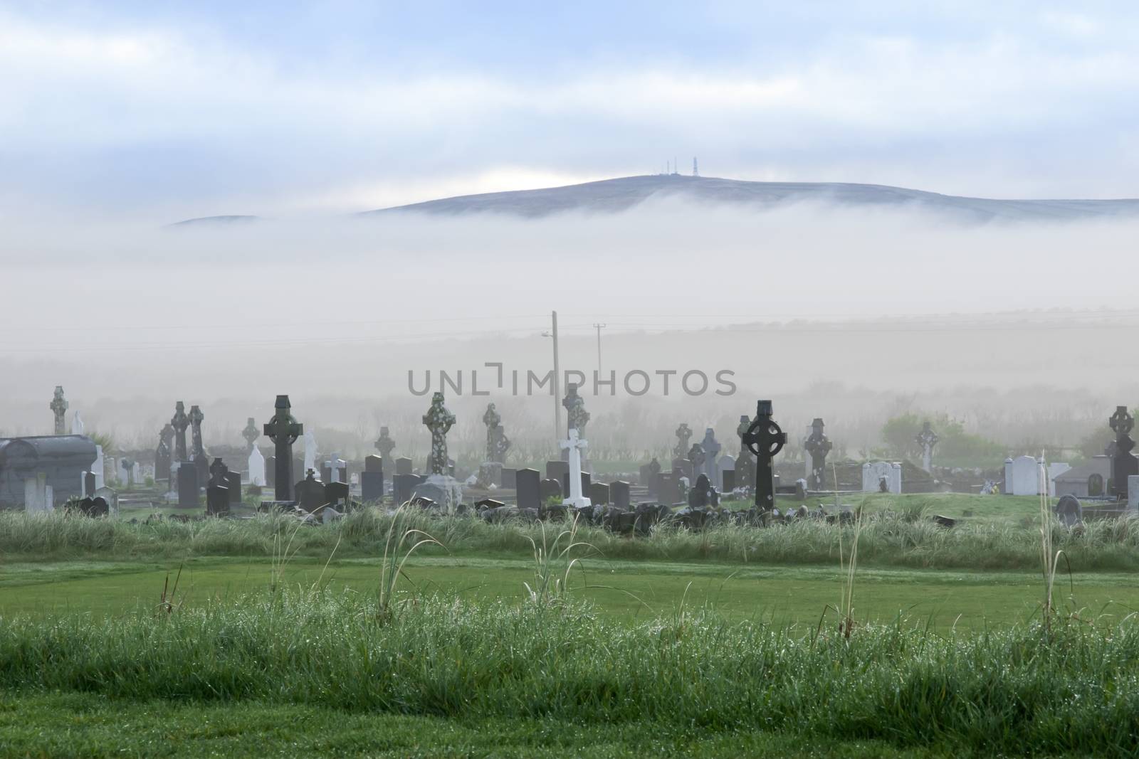 Fog rolling into the graveyard next to Ballybunion golf course in county Kerry Ireland