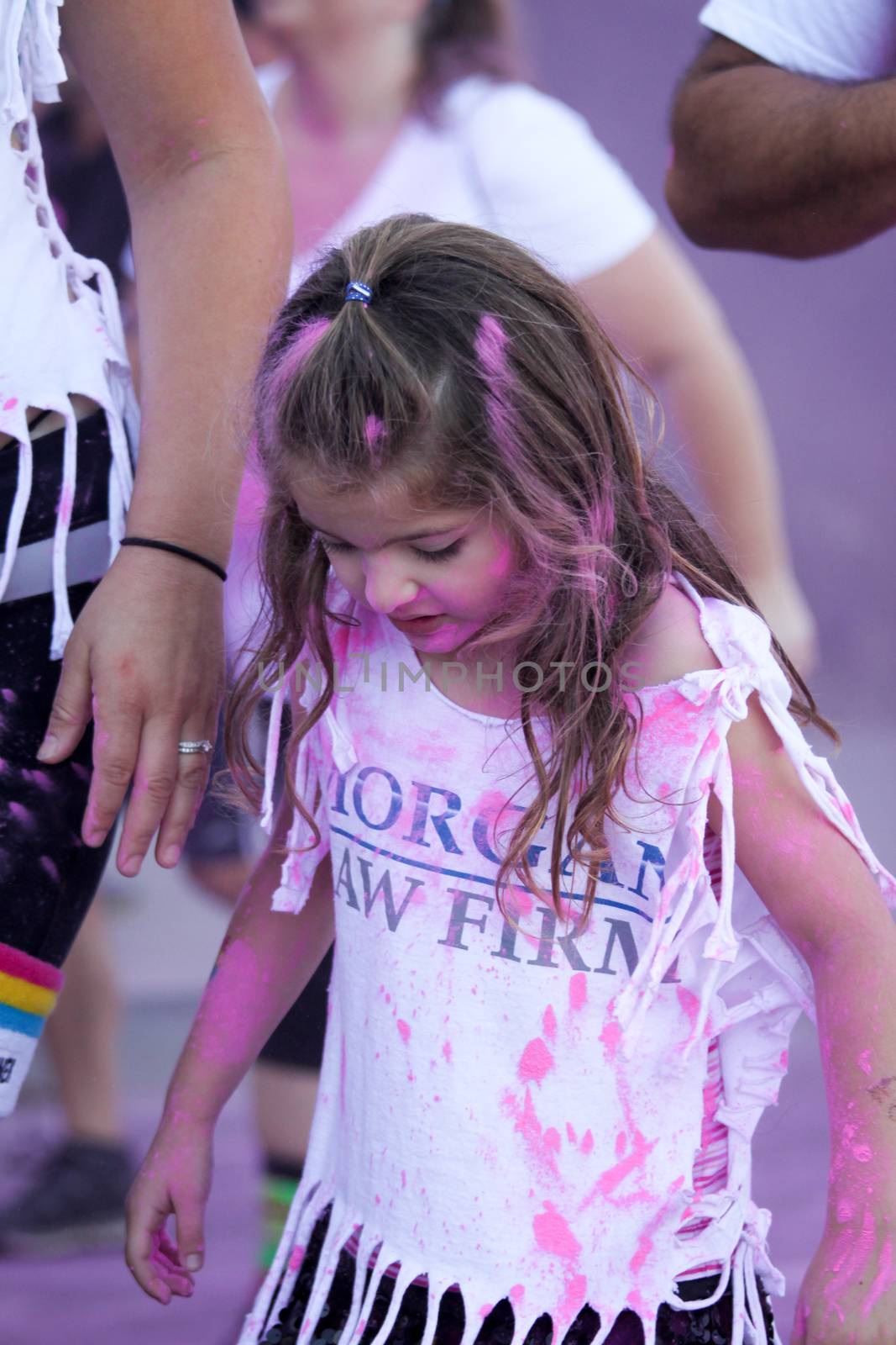 Ventura, CA - OCTOBER 18 : Participants coming through the pink color station at The Color Run 2014 in Ventura. OCTOBER 18, 2014 in Ventura, CA.