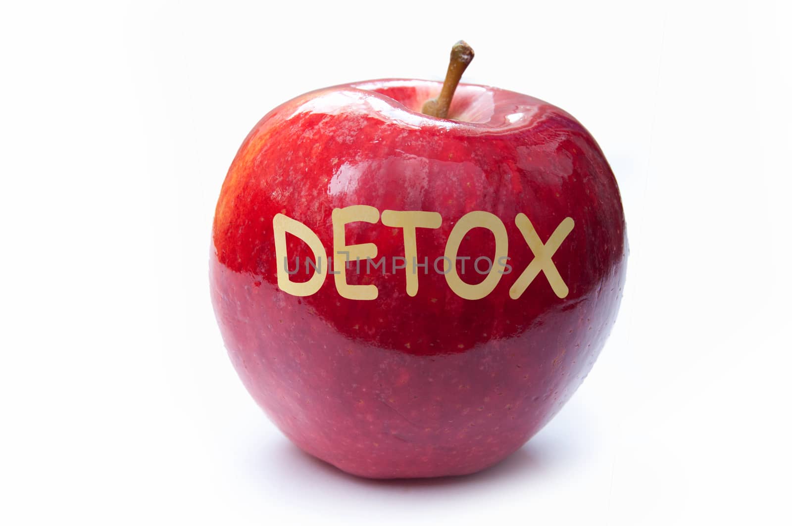 Detox cut into a red apple 