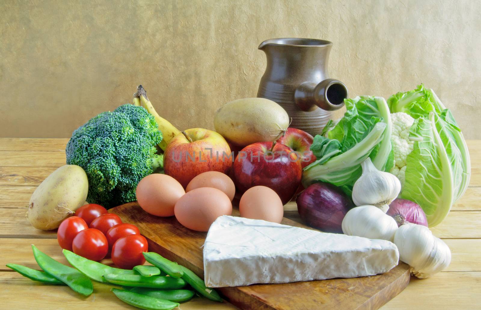 Fresh organic produce including fruits, vegetables, cheese and wine