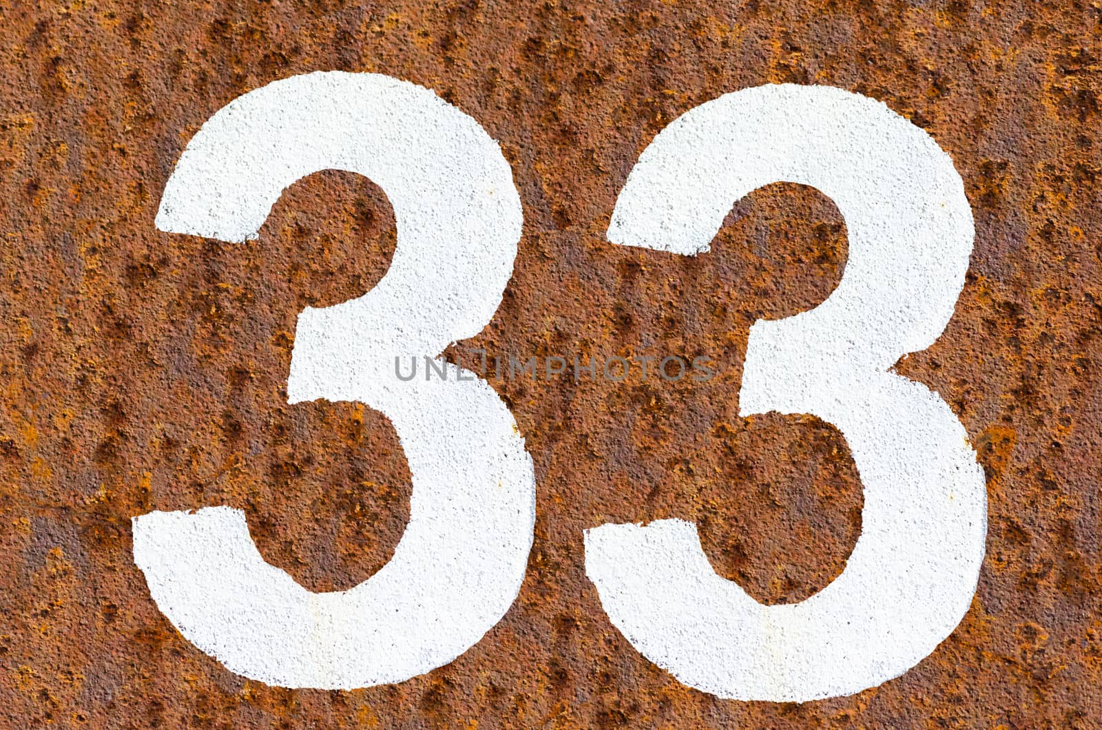 Rusty iron background with beautiful structure and number in white paint.