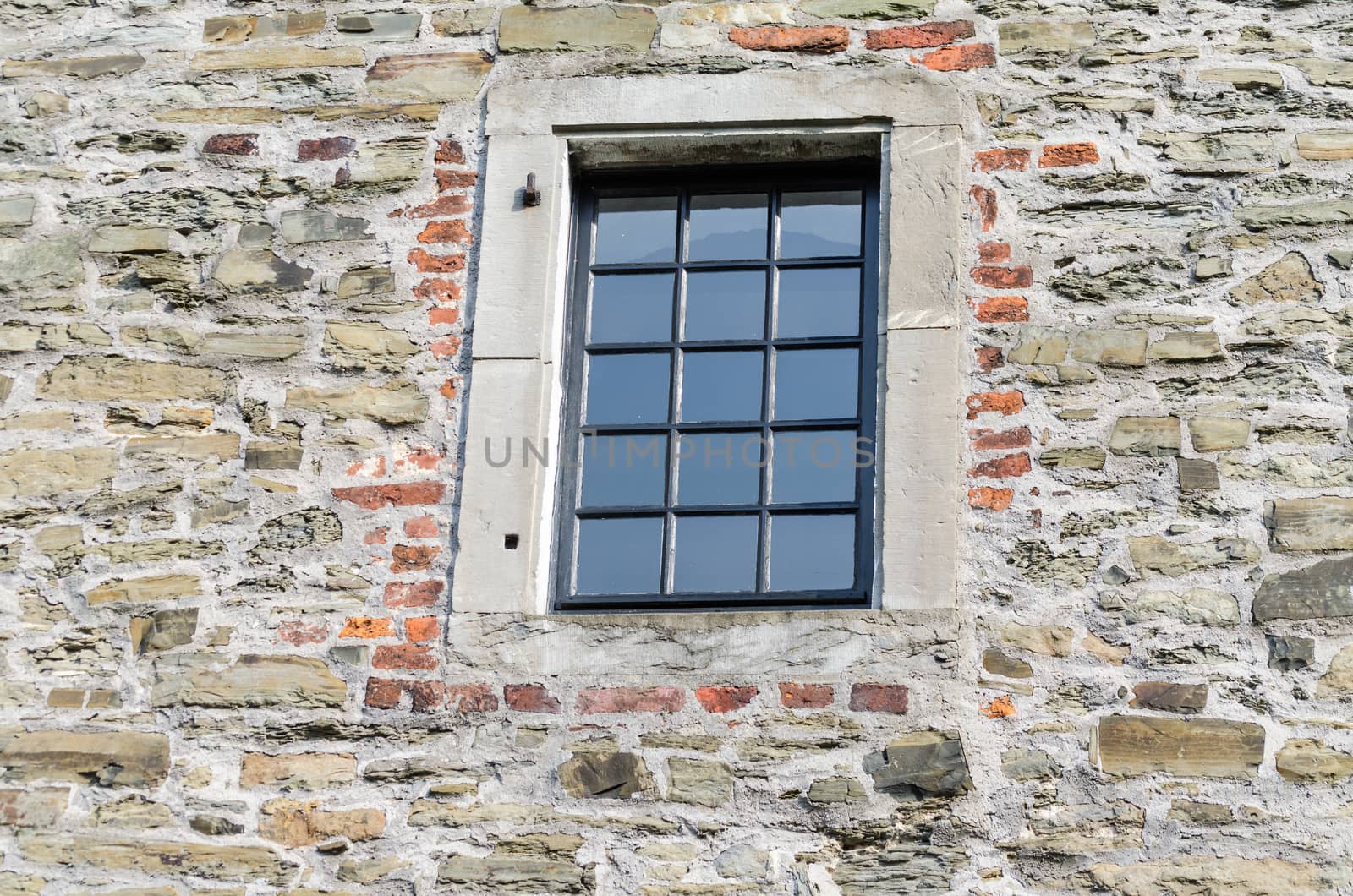 Historic window of a castle with stained glass
