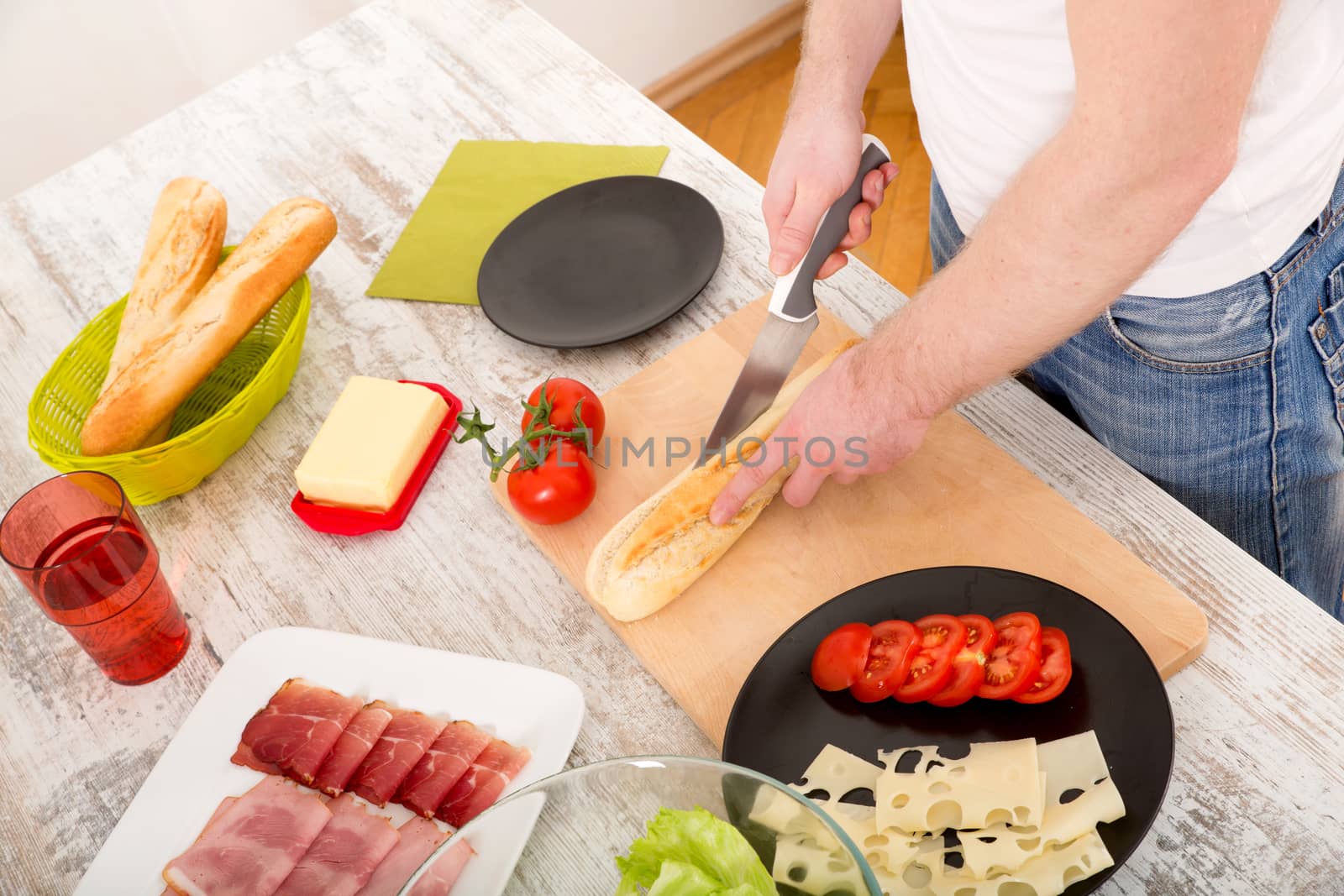 Young man preparing a Sandwich by Spectral