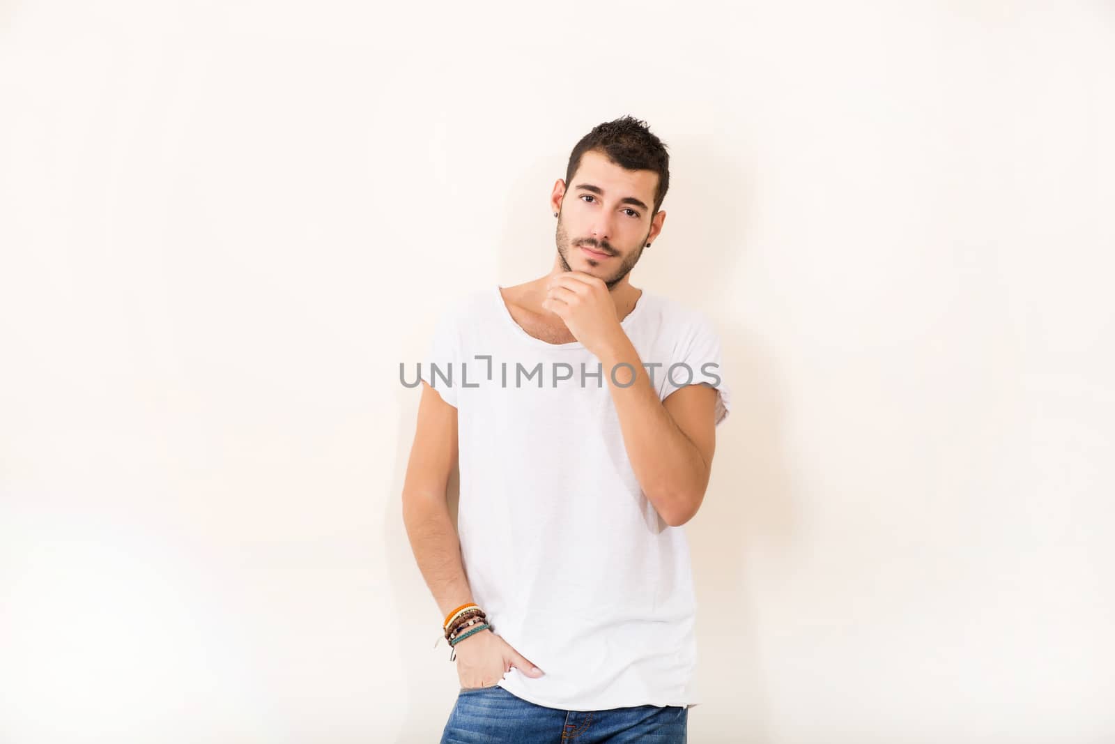 Portrait of a relaxed latin man in casual clothes.