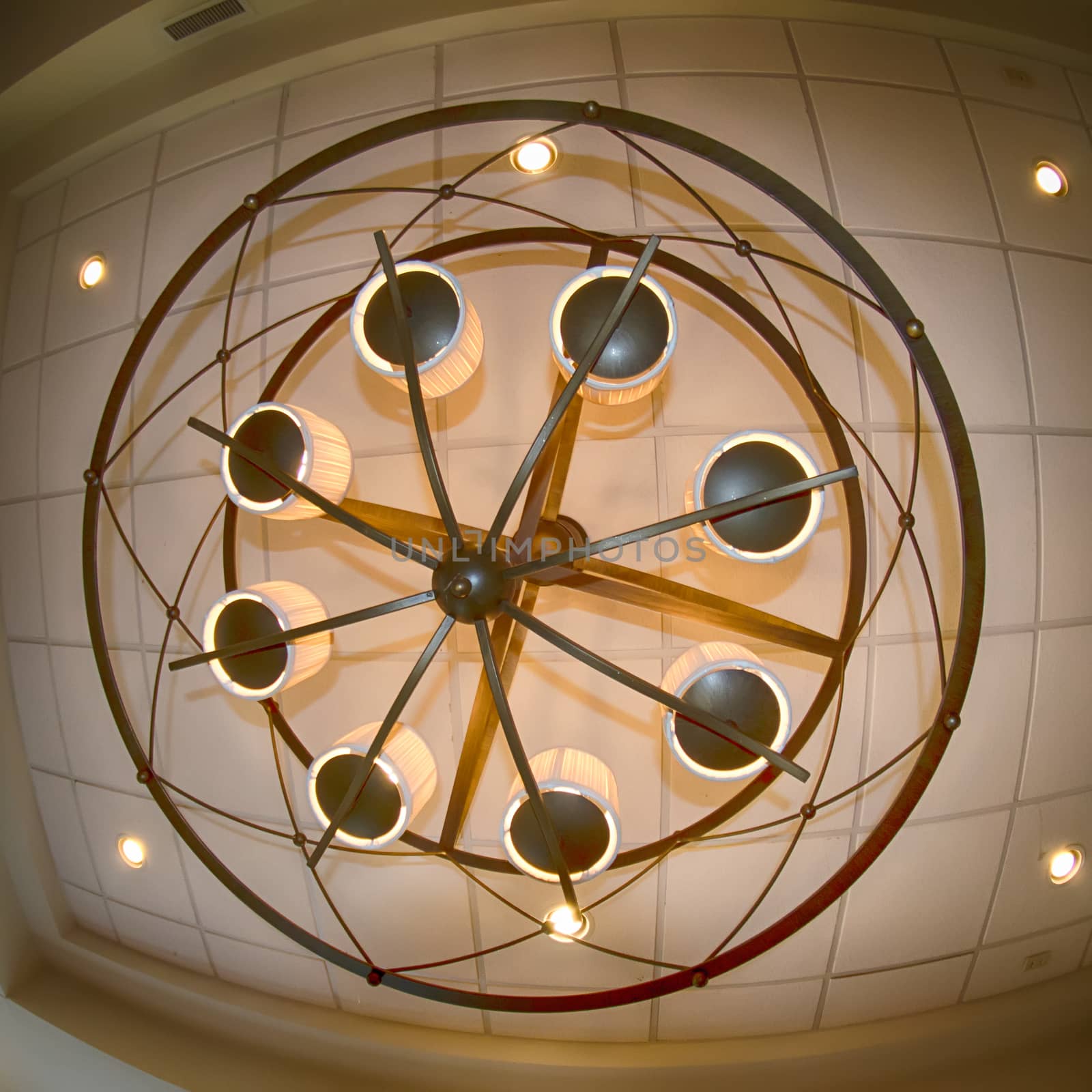 looking up at large modern chandelier