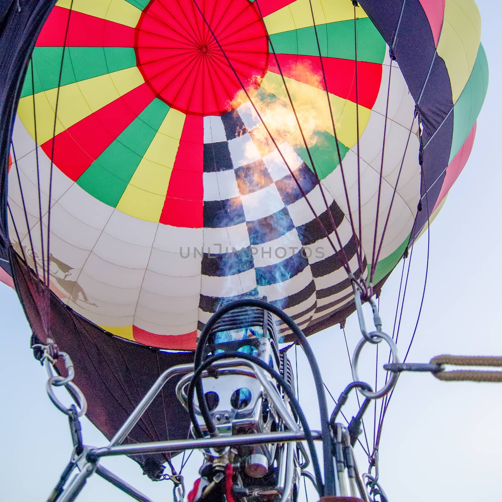 Fire heats the air inside a hot air balloon at balloon festival  by digidreamgrafix