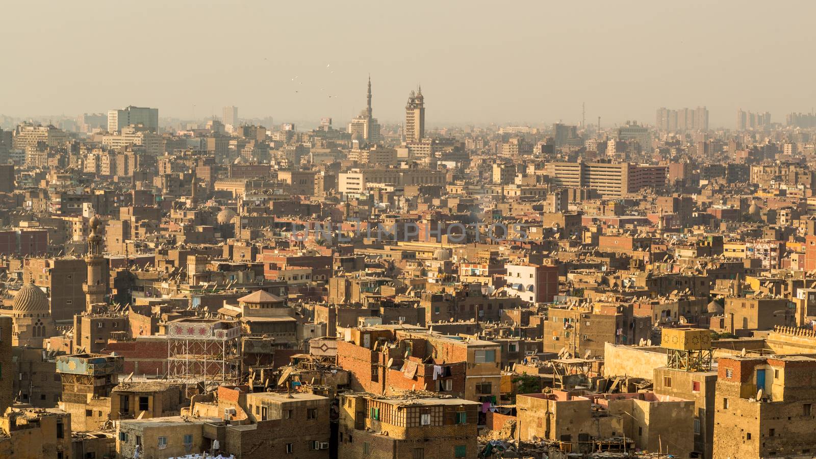 Aerial view of the city of Cairo with densely packed residential homes and buildings