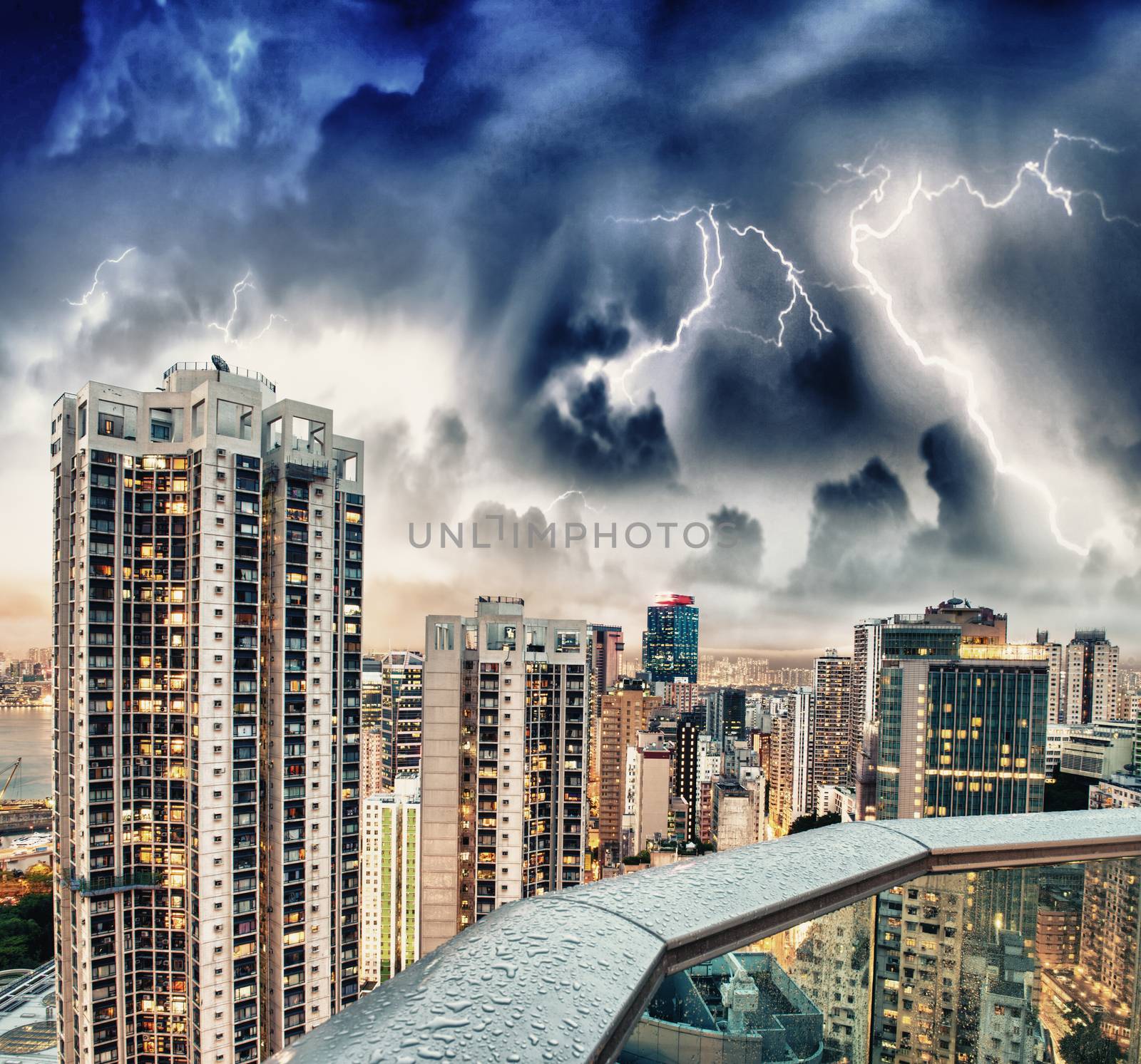 Bad weather over city skyscrapers on a modern city by jovannig