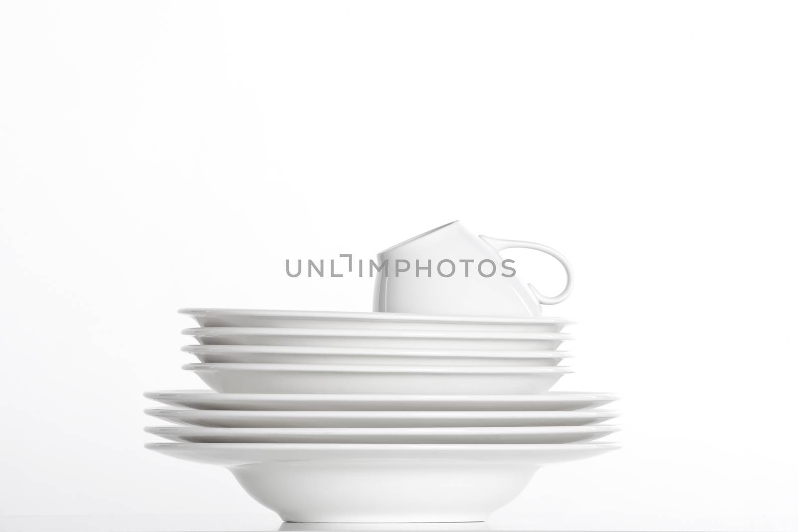 white plates and cup by courtyardpix