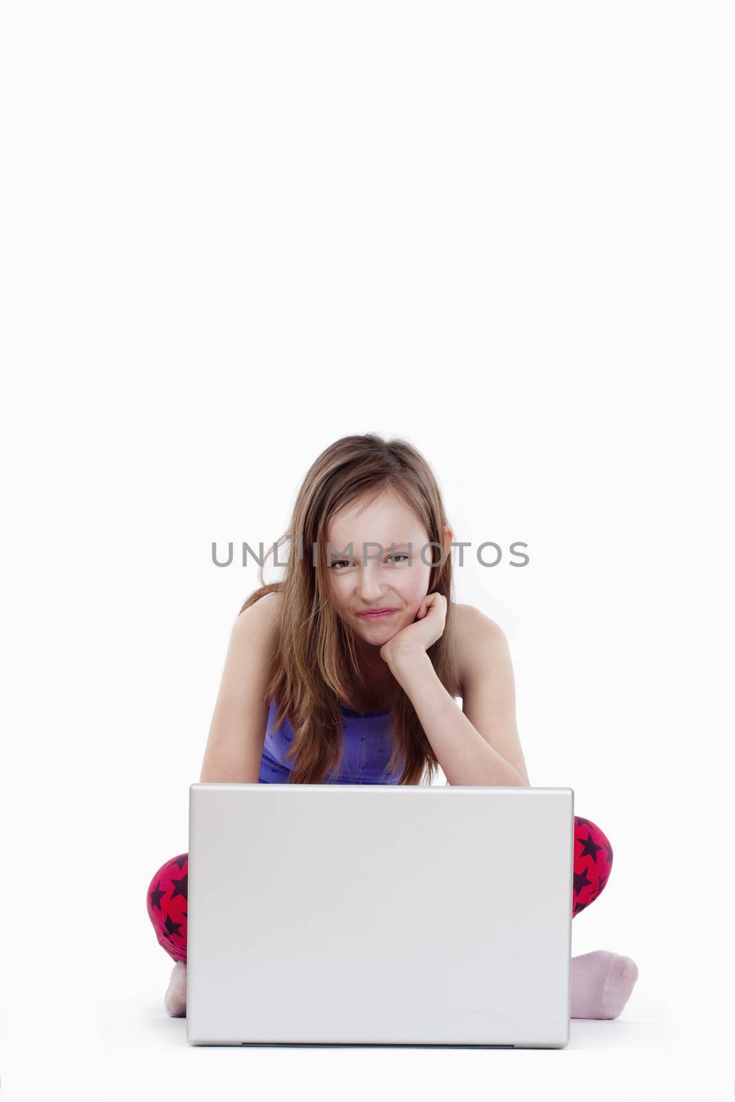 young girl with laptop computer smiling - isolated on white