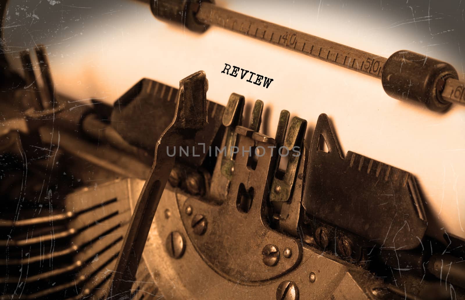 Close-up of an old typewriter with paper, selective focus, review