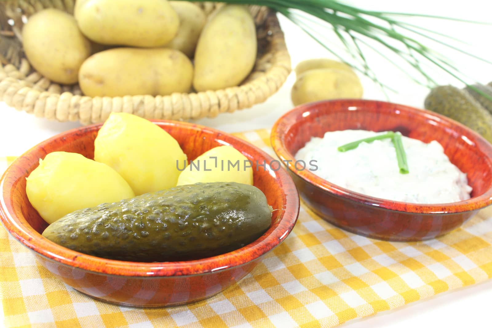 Potatoes and curd with pickles on a light background