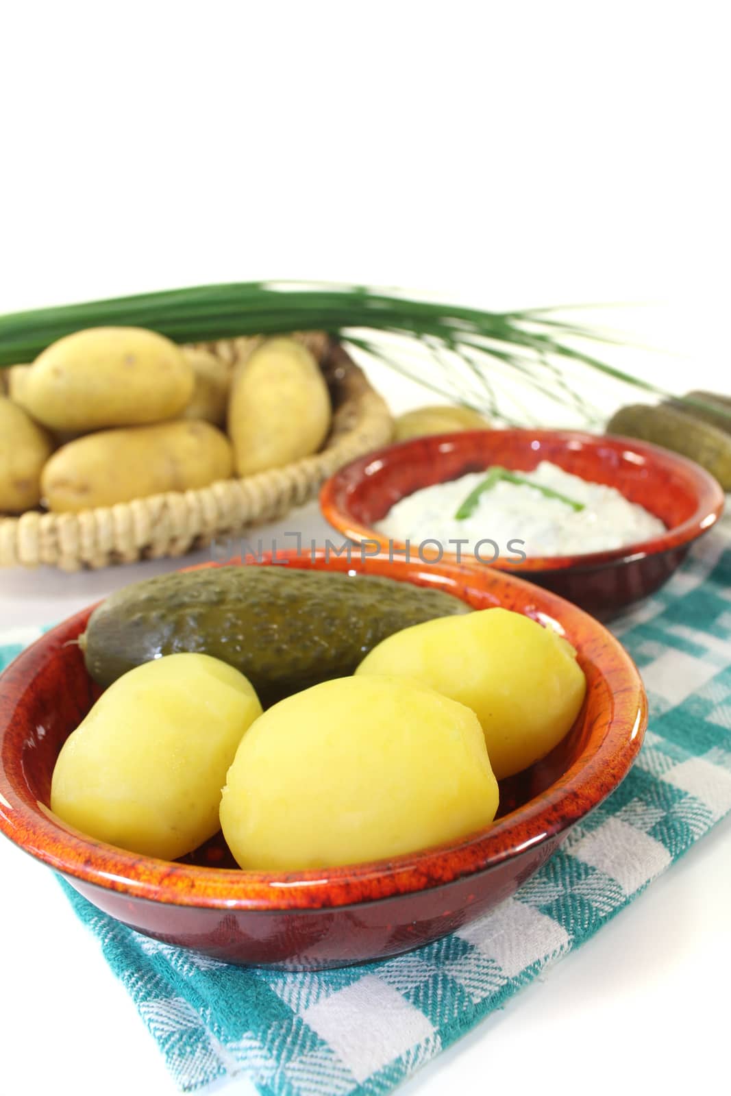 Potatoes with chives on a light background