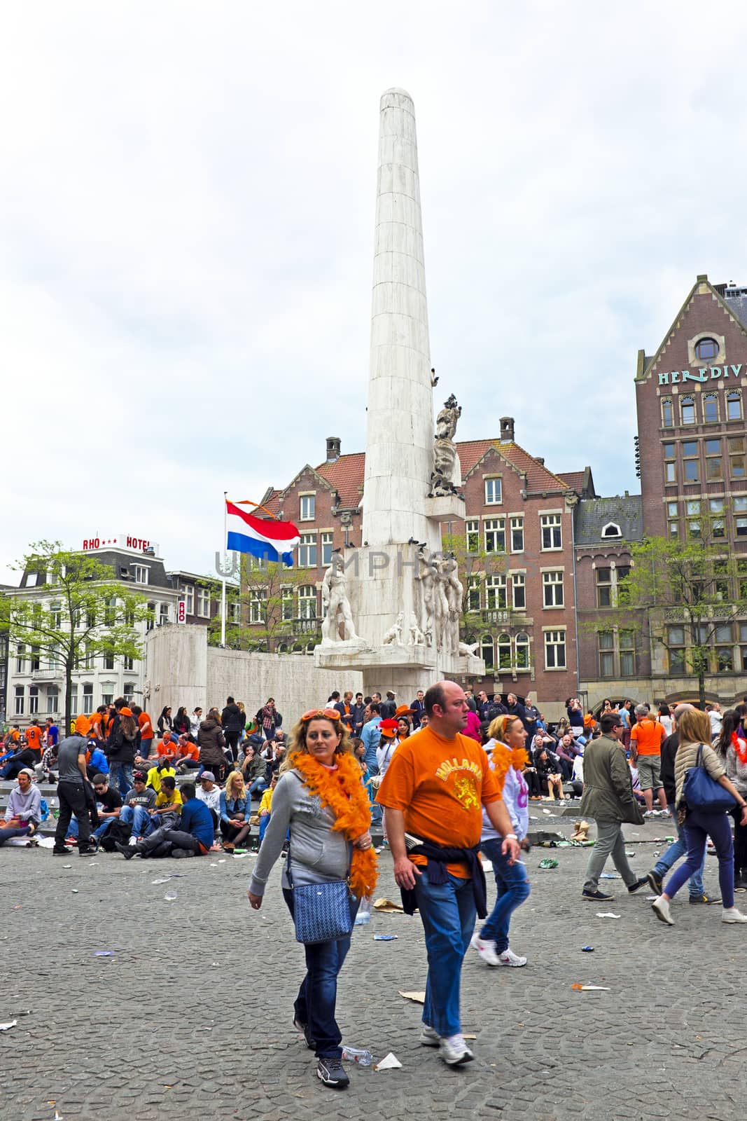 AMSTERDAM - APRIL 26: On the Dam square people in orange celebrating kings day on April 26, 2014 in Amsterdam, The Netherlands