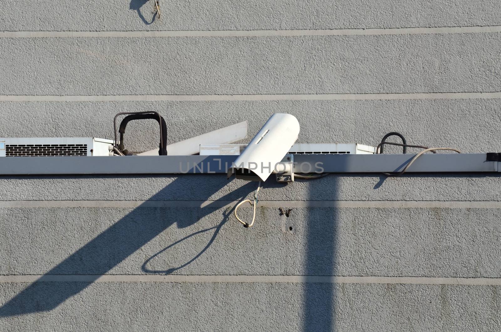 Surveillance camera on a wall