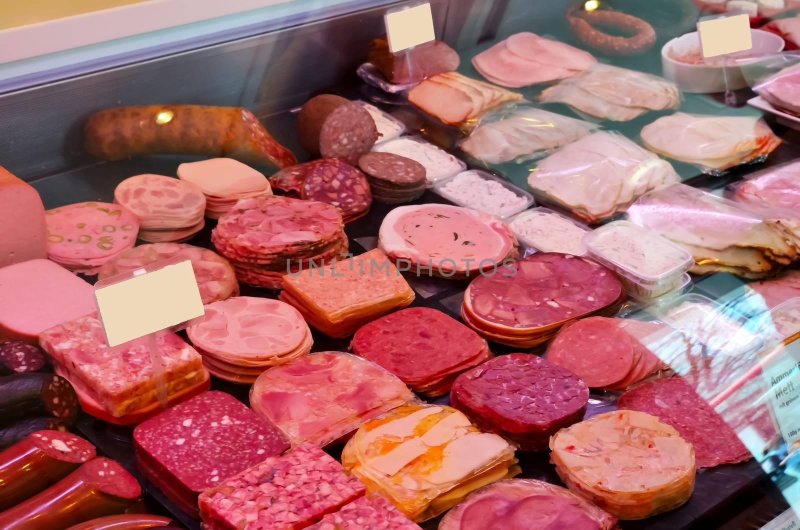 The well-stocked sausage window of a butcher shop