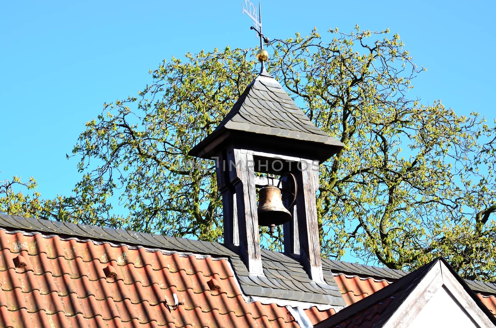 Bell Tower: tower with a bell hung in a belfry on a building roof eye wear,