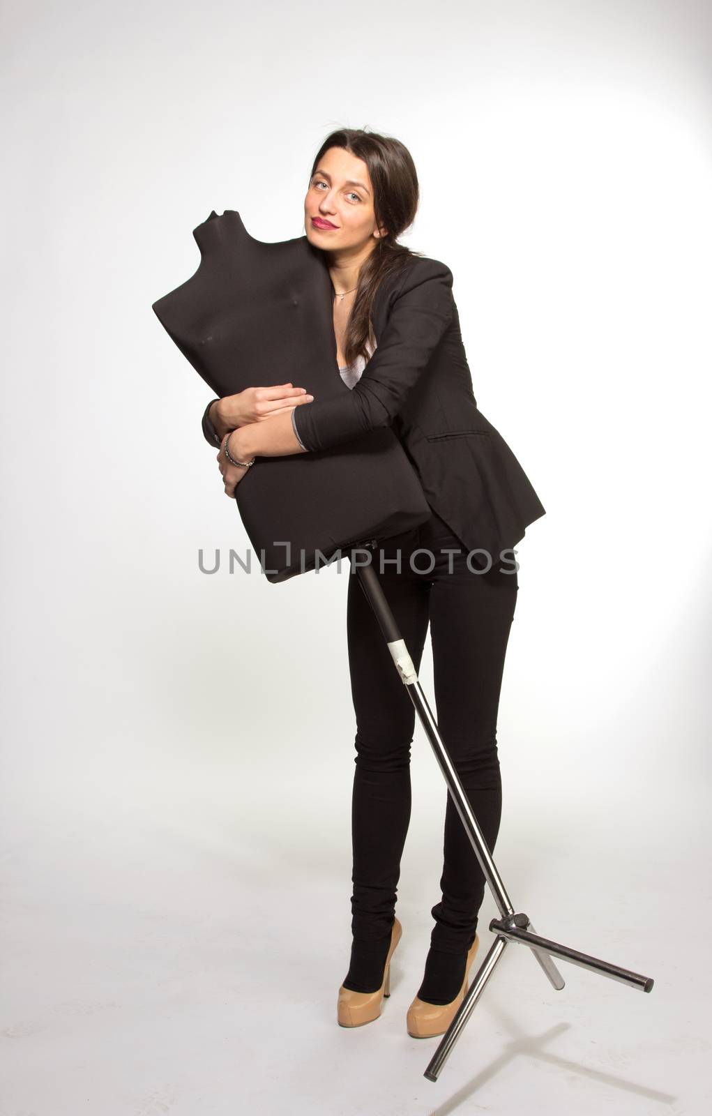 Woman tailor holding on Mannequin, isolated on white