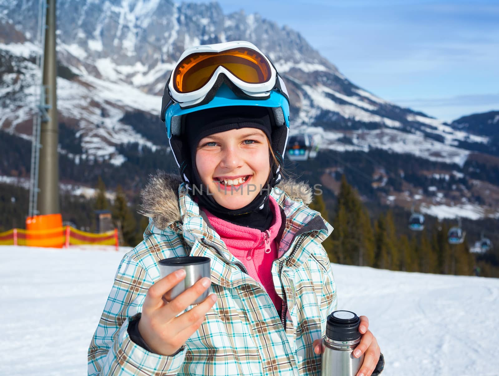 Ski, skier, winter. Lovely girl has a fun on ski - resting and drinking tea.