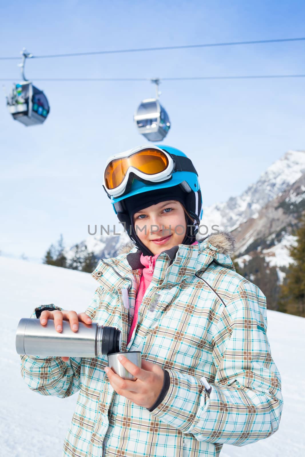 Ski, skier, winter. Lovely girl has a fun on ski - resting and drinking tea.