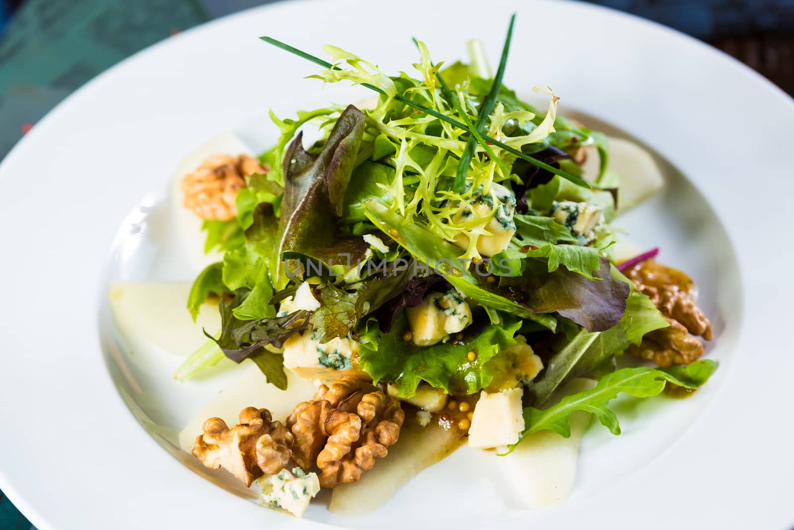 Fresh organic vegetable salad on whte plate. Close up