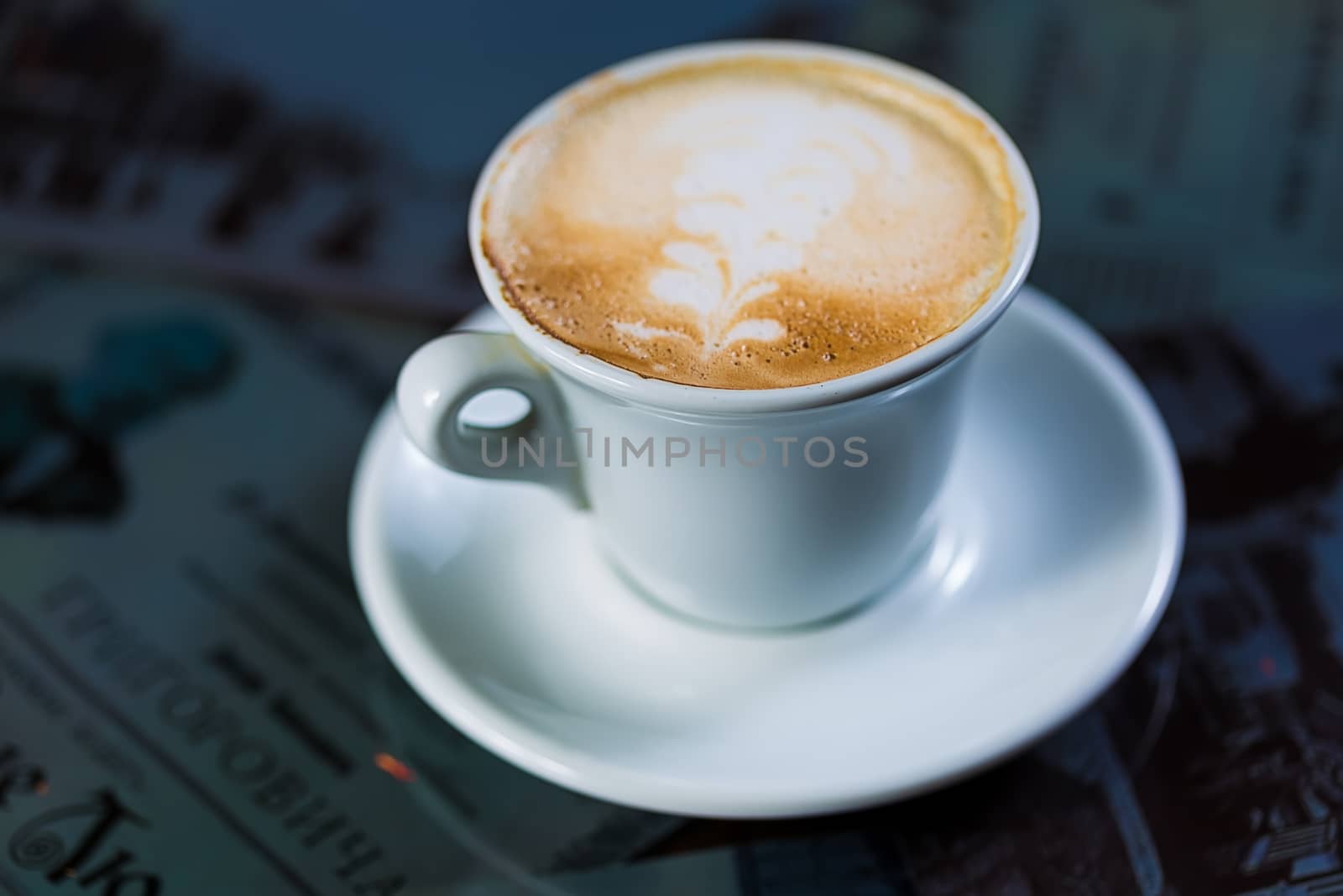 Cup of coffee on a table. Close up